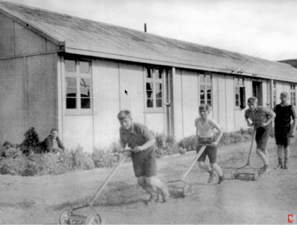 Pahiatua, NZ: And now some older boys try their hand at a mower.PHOTO courtesy of the Kresy-Siberia Virtual MuseumExhibition: Daily Life