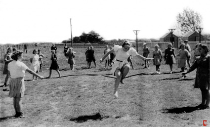 Pahiatua, NZ: Girls skip rope in the warm Pahiatua sun.PHOTO courtesy of the Kresy-Siberia Virtual MuseumExhibition: Daily Life