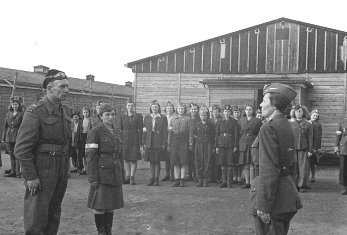 Last roll call at Stalag VI-C: Note the Polish red-and white-armbands on many of the prisoners’ arms – meaning they fought in the Warsaw Uprising. 